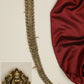 Antique temple long jade featuring Lakshmi motif and floral connectors