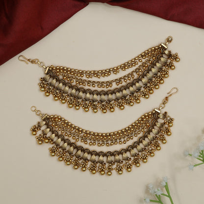 Traditional mati design with shell-inspired elements and bead fringe