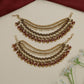 Traditional mati design with shell-inspired elements and bead fringe