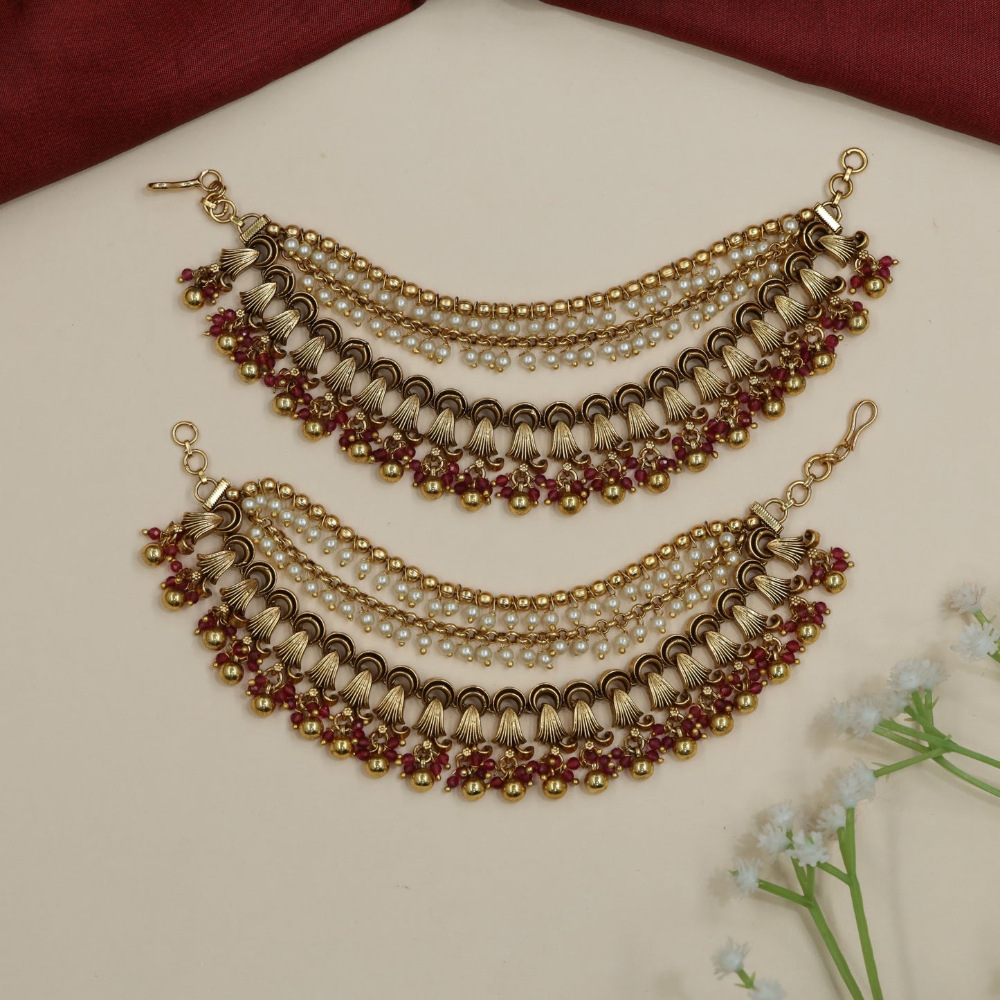 Traditional mati design with shell-inspired elements and bead fringe