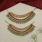 Traditional mati design with shell-inspired elements and bead fringe