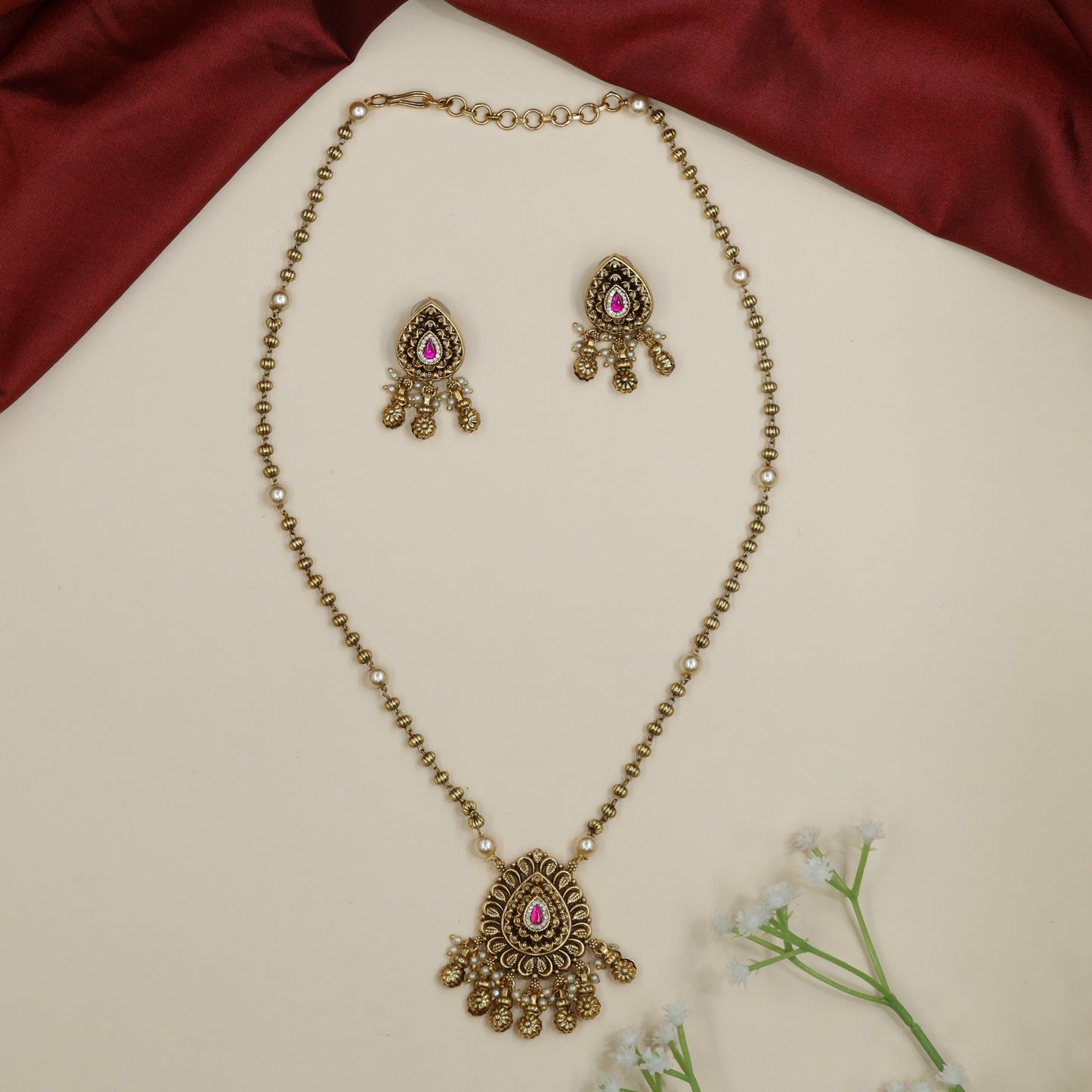 Antique statement chain with decorative pendant and green bead embellishments