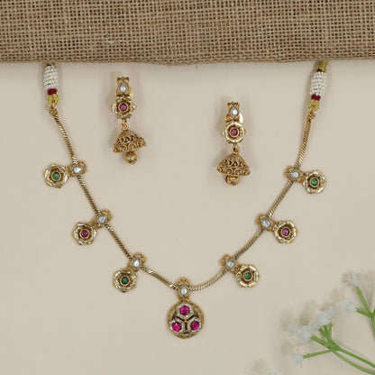 Prestige Kundan Necklace Finished with Raised Circular Rims and Bell Drops