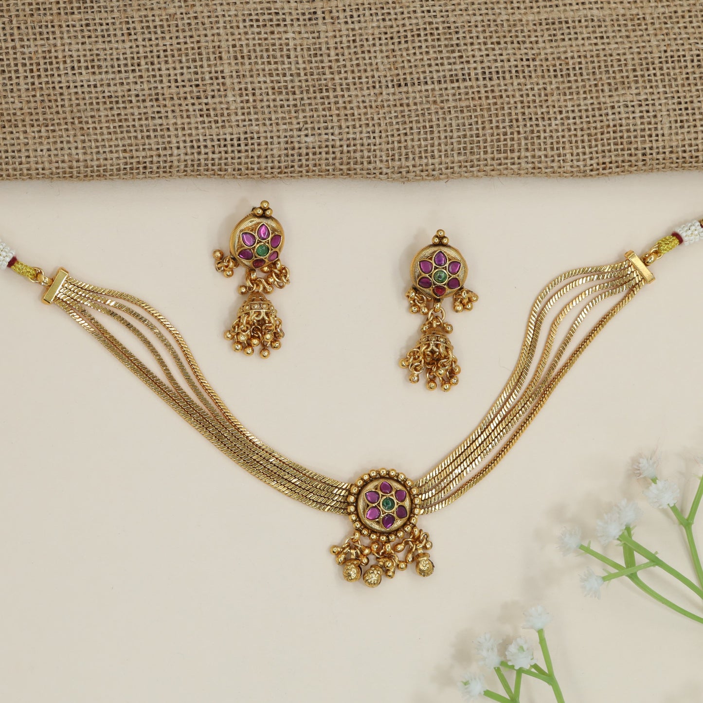Rosette centrepiece kundan necklace with cascading ornamental accents