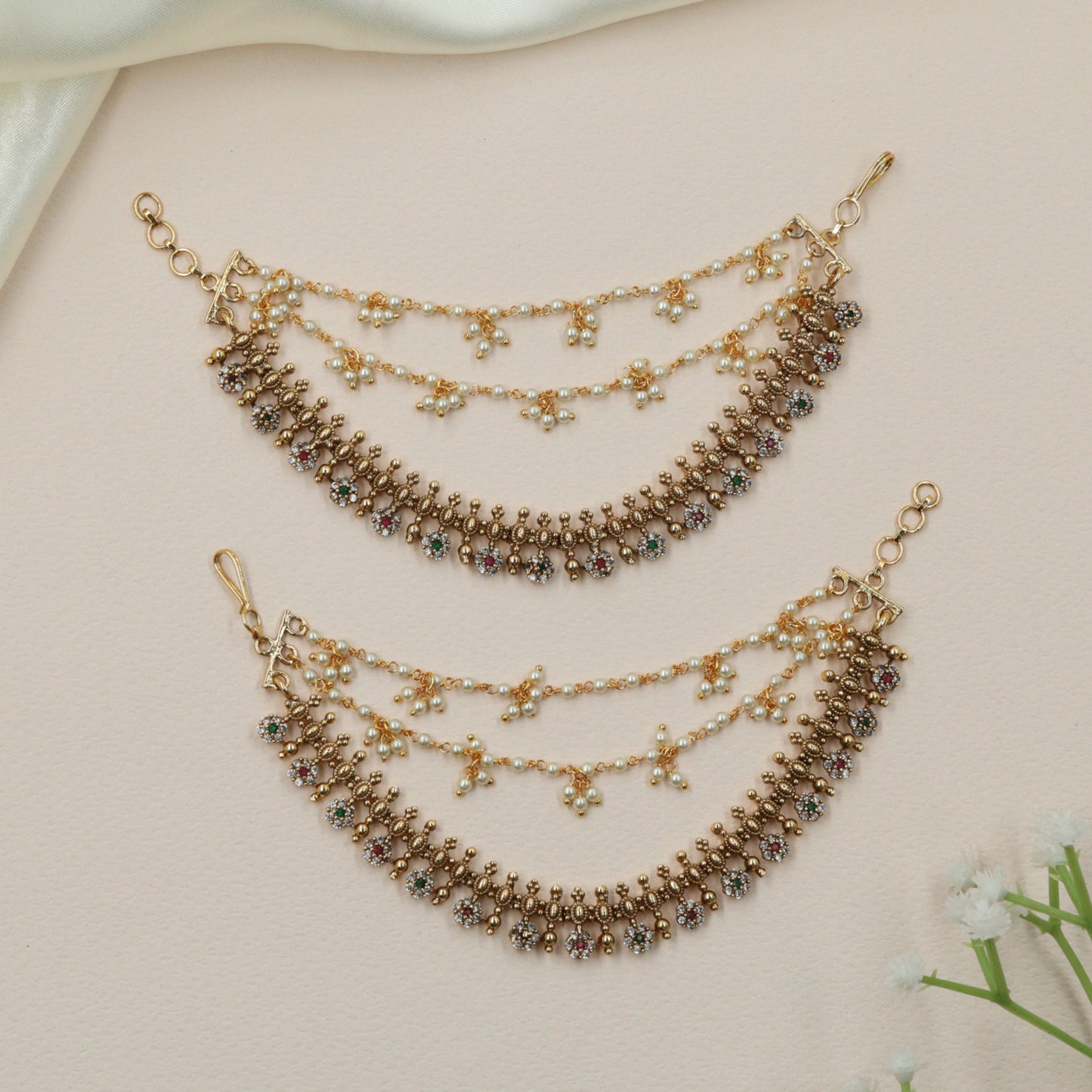 Traditional mati with floral cluster fringe design