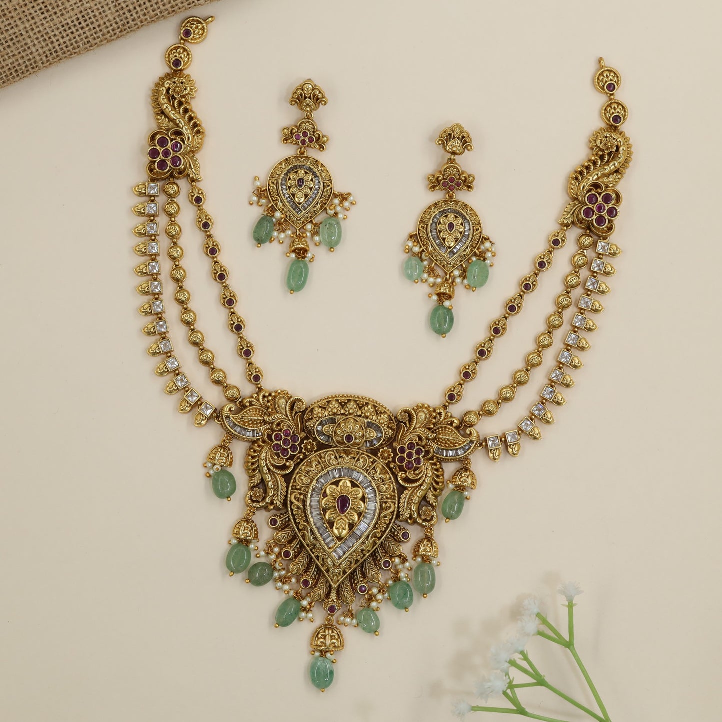 Peacock floral necklace with ornate pendant construction