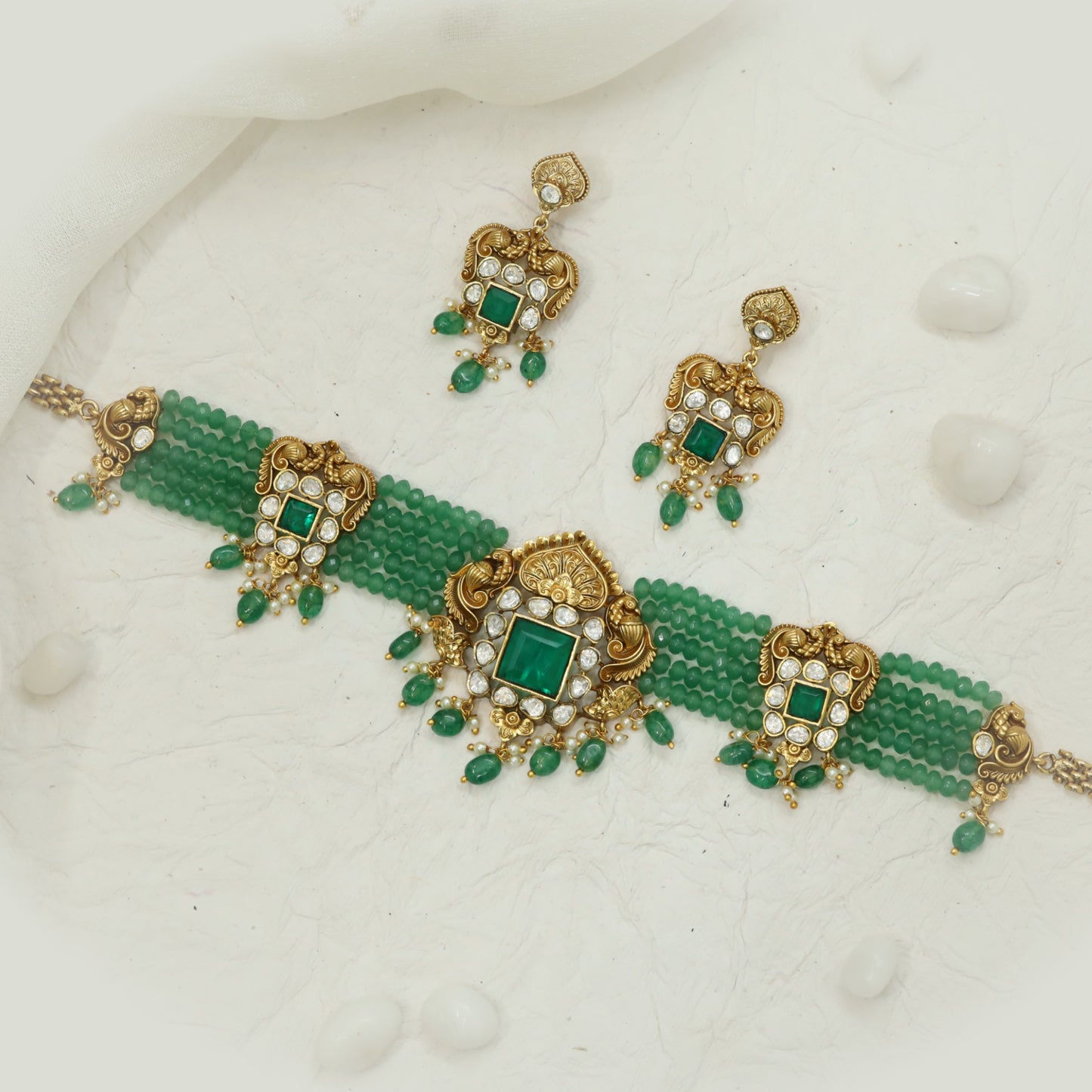 Emerald beads choker with temple-inspired centerpiece detailing