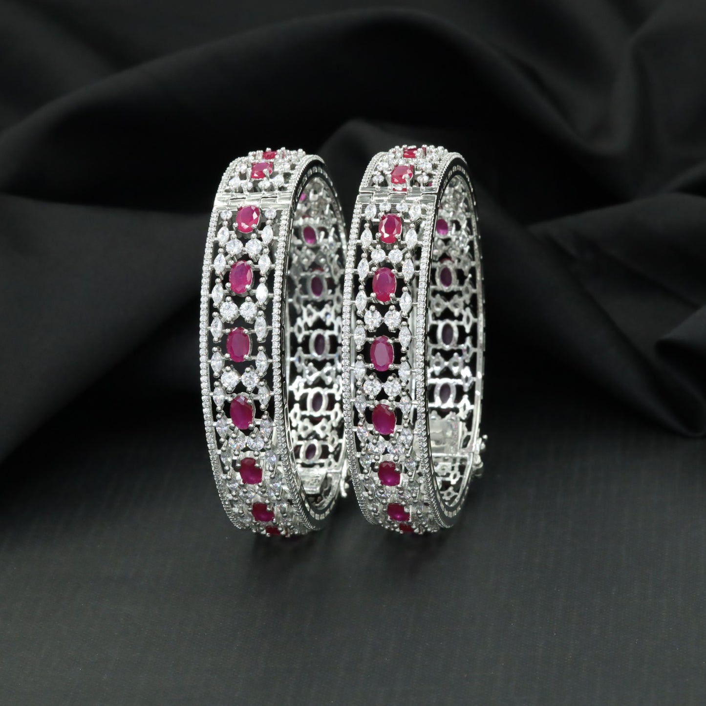 Floral cluster Rhodium bangles with architectural styling