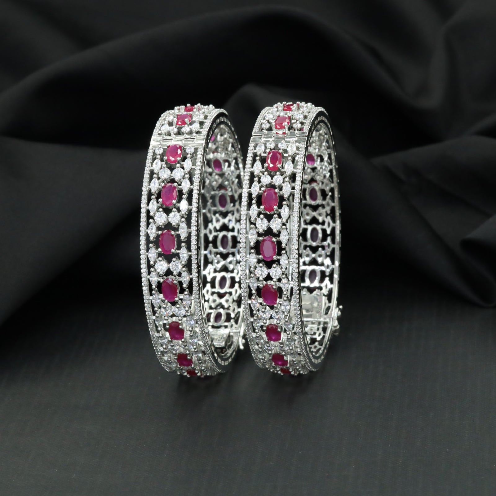 Floral cluster Rhodium bangles with architectural styling