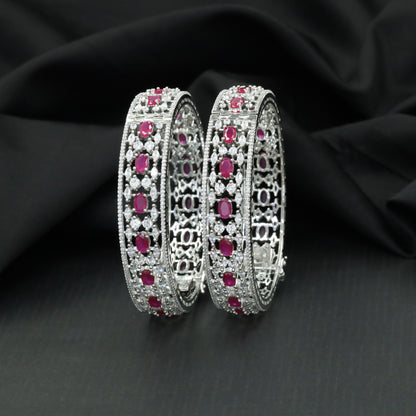 Floral cluster Rhodium bangles with architectural styling