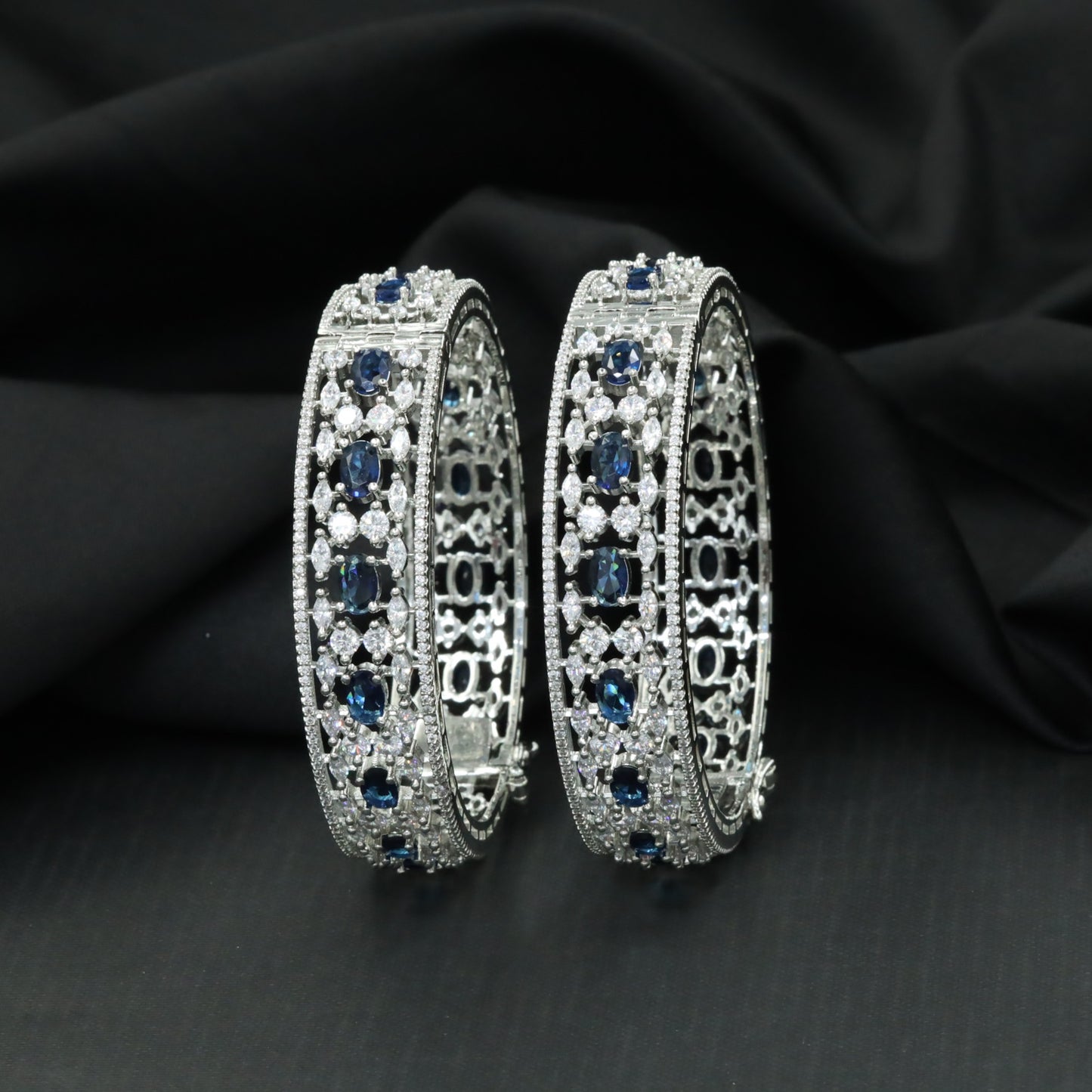 Floral cluster Rhodium bangles with architectural styling