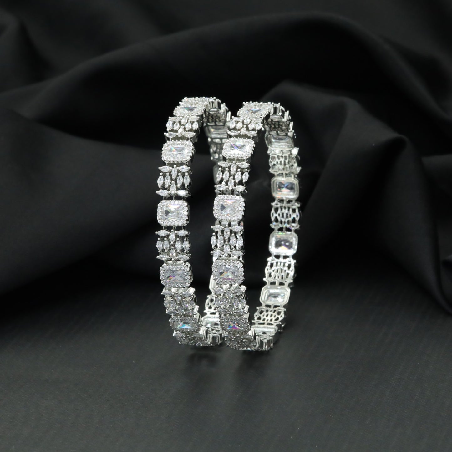 Cushion cut tennis bangles with marquise cluster detailing