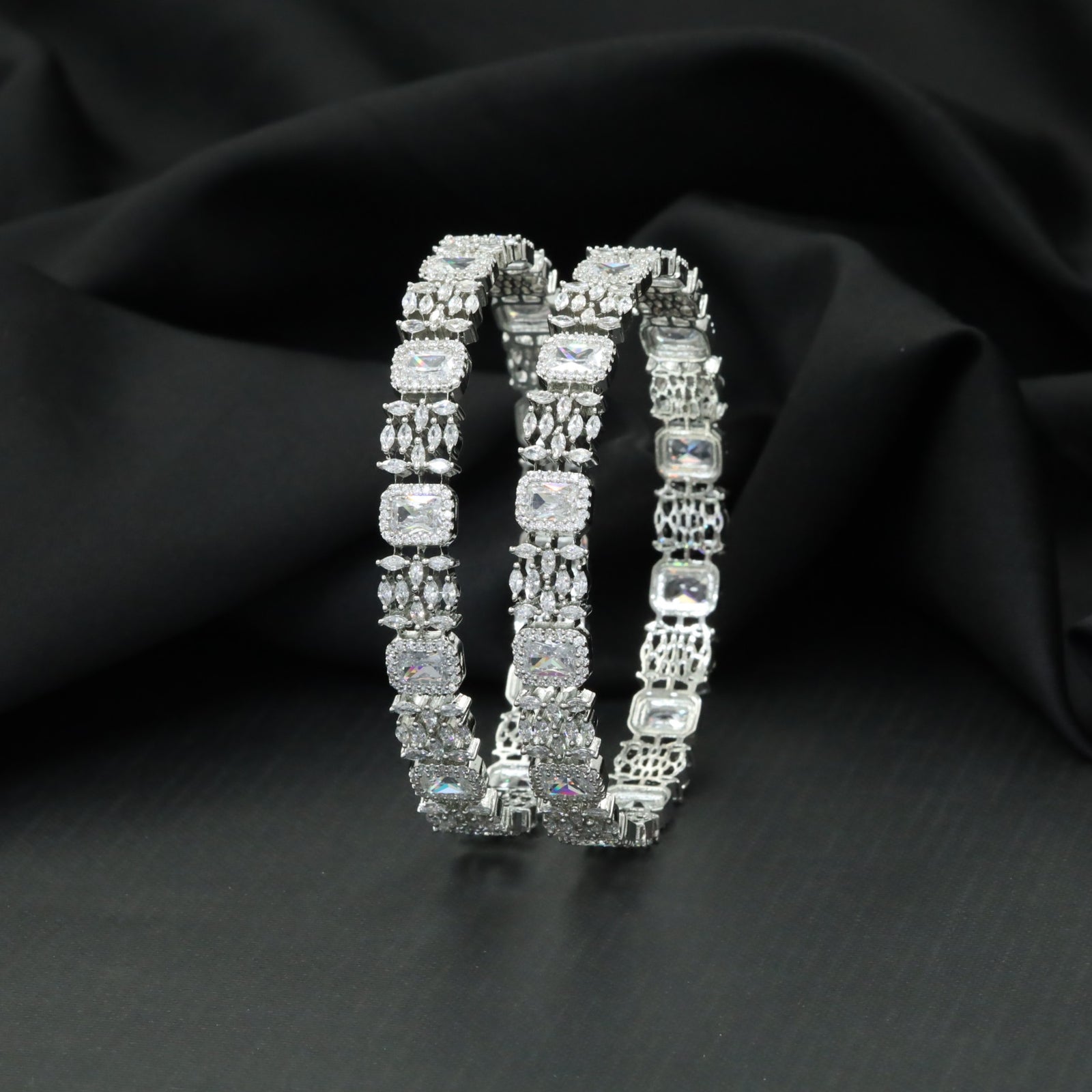 Cushion cut tennis bangles with marquise cluster detailing