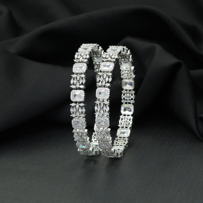 Cushion cut tennis bangles with marquise cluster detailing