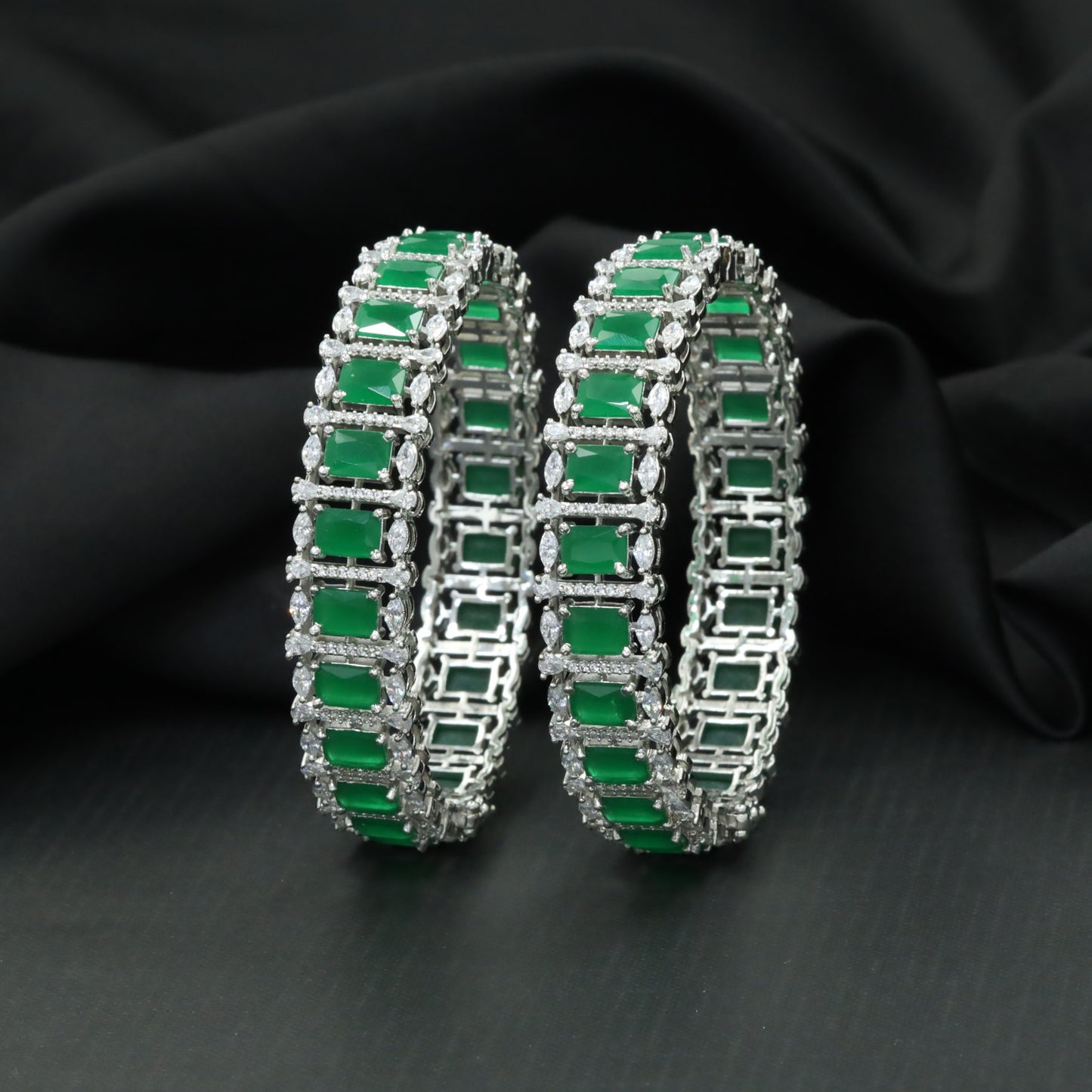 Rectangular station bangles with continuous halo border