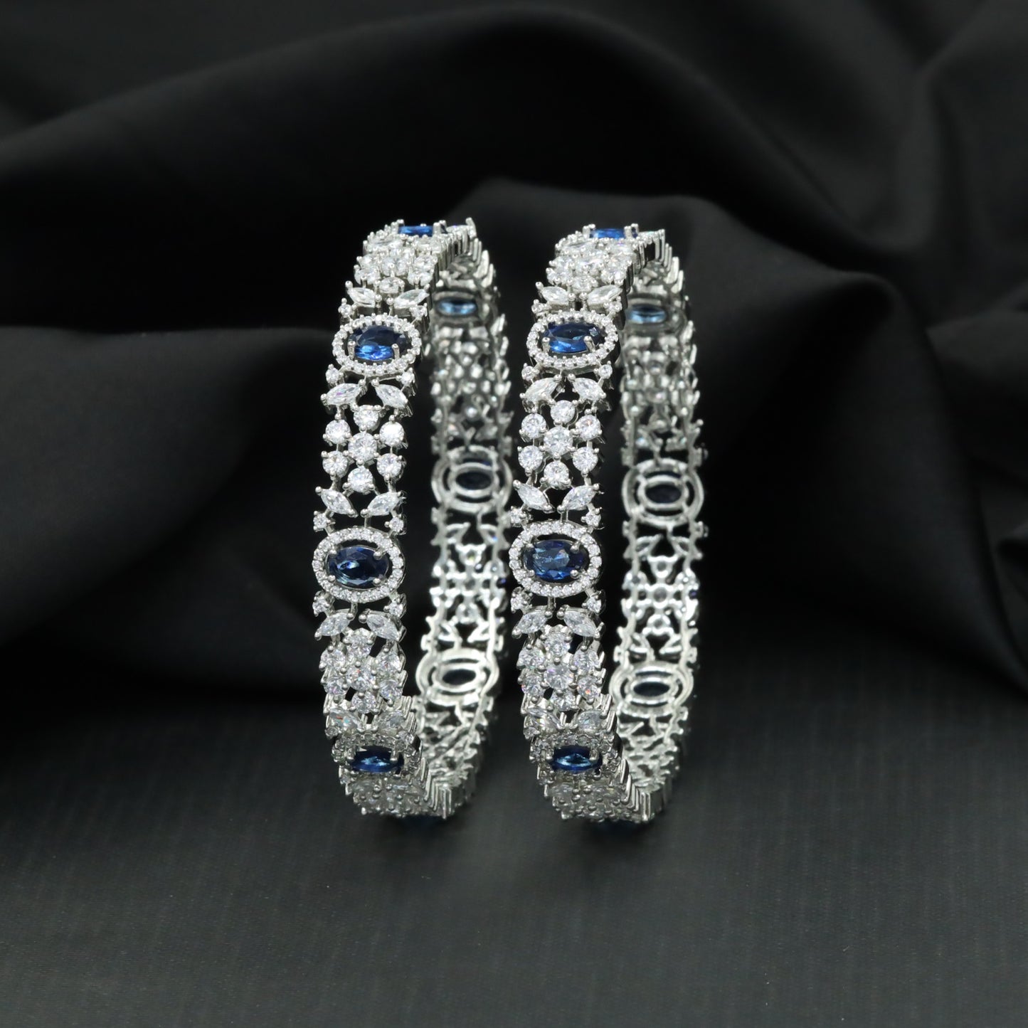 Designer Rhodium bangles with oval halo stations