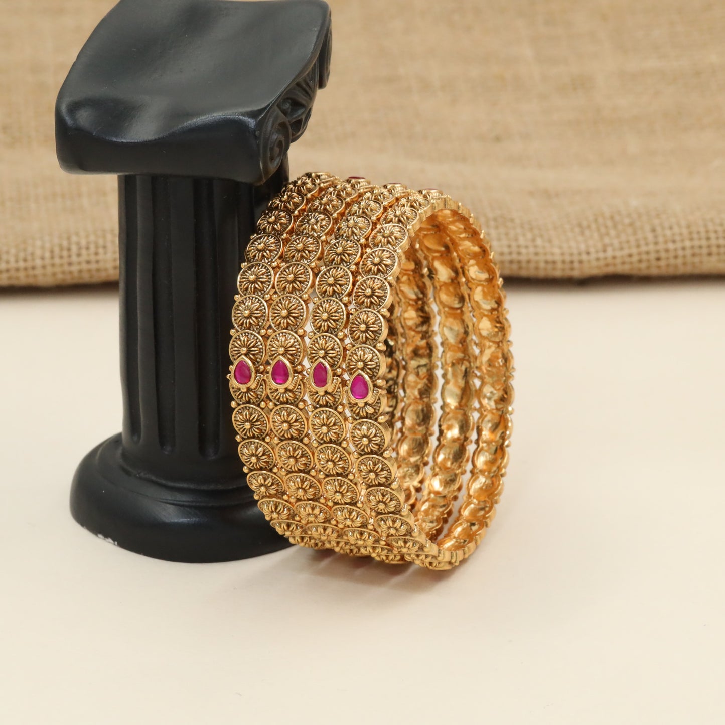 Rosette medallion bangles with floral coin detailing