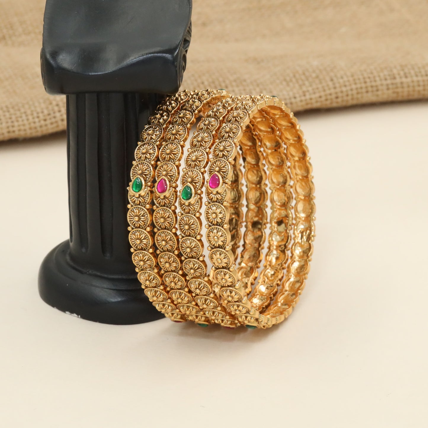 Rosette medallion bangles with floral coin detailing