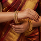 Rosette medallion bangles with floral coin detailing
