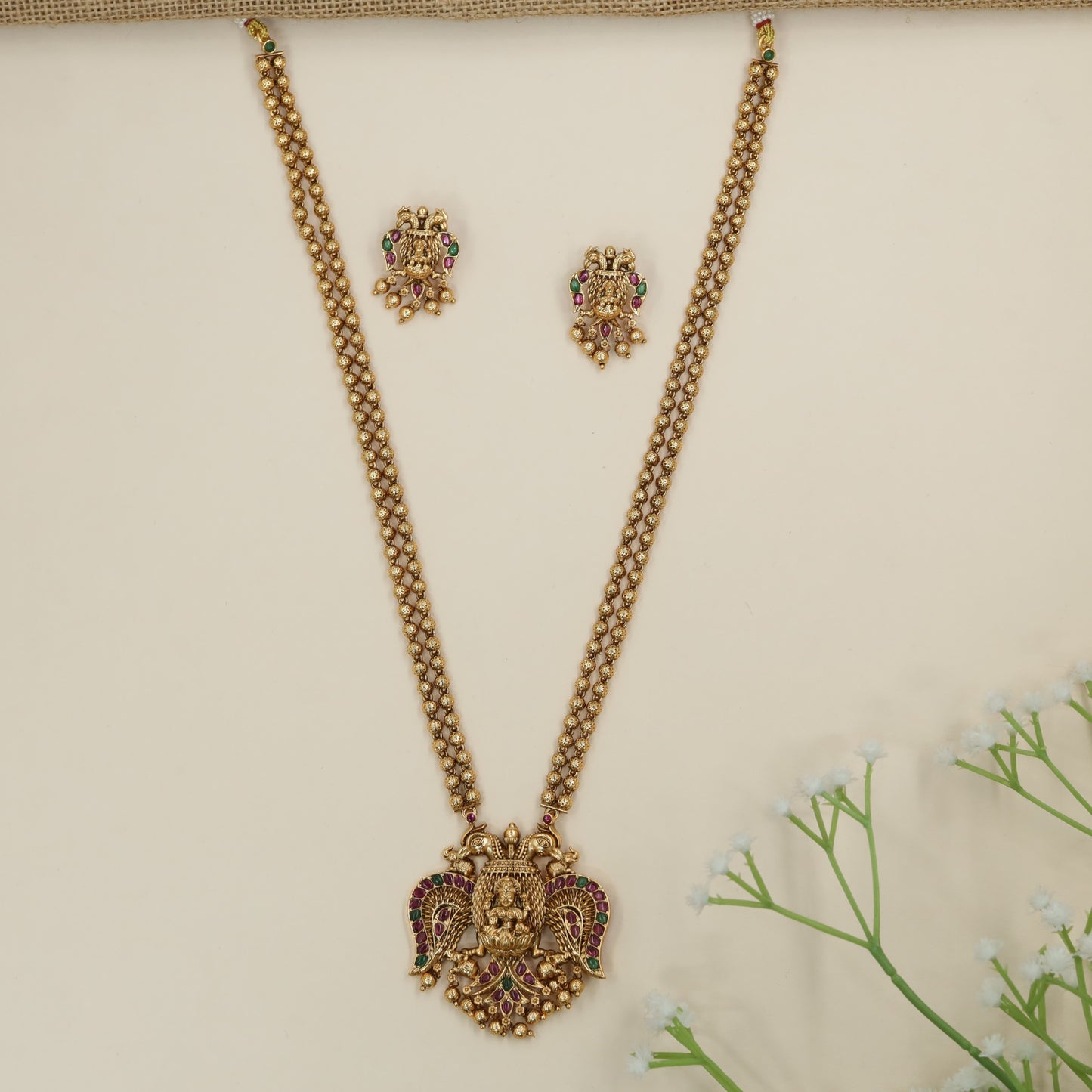 Gandaberunda chain pendant with decorative bead fringe