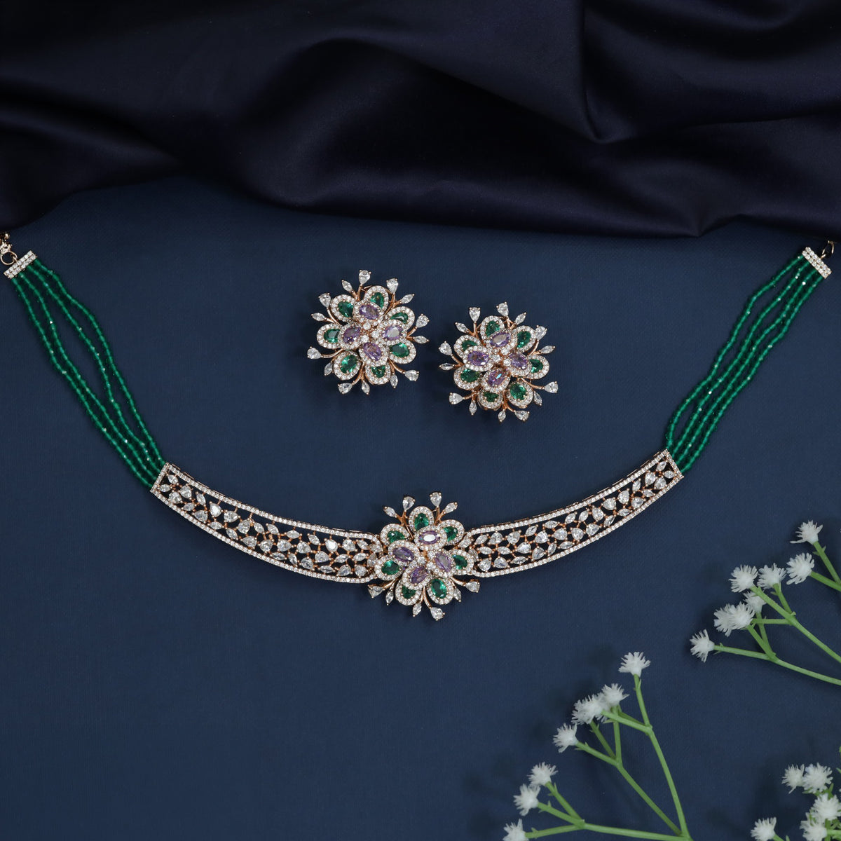 Rose gold choker featuring a decorative floral clasp