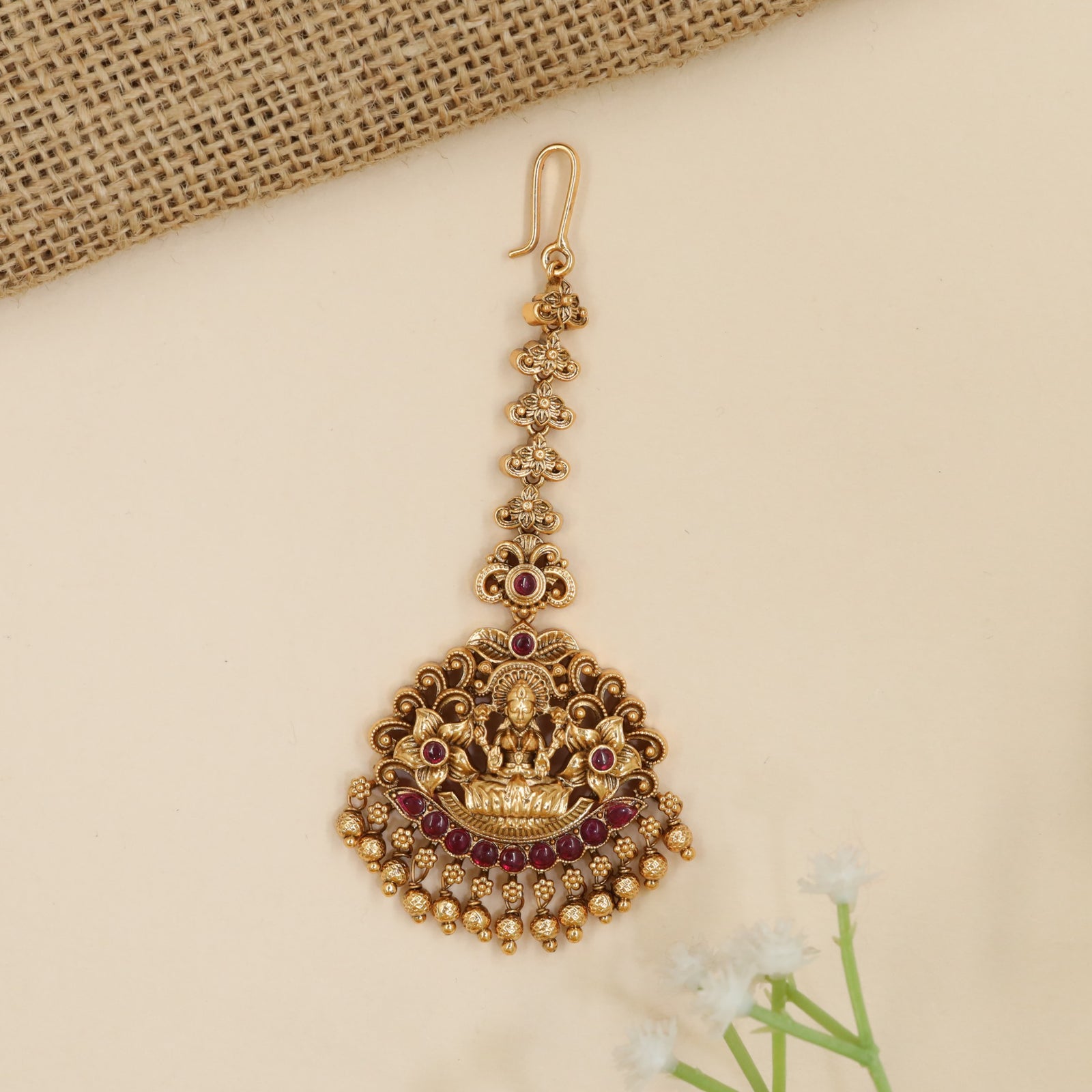 Designer temple tikka with Goddess Lakshmi centerpiece and intricate scrollwork