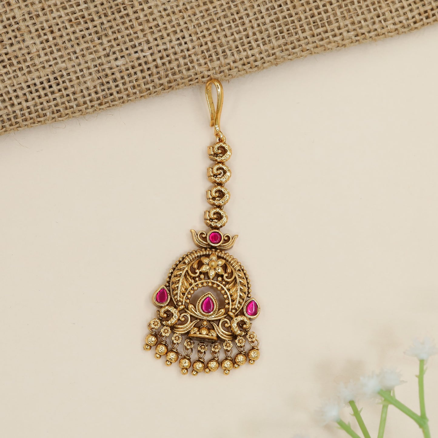 Traditional antique tikka with ornate arch detailing