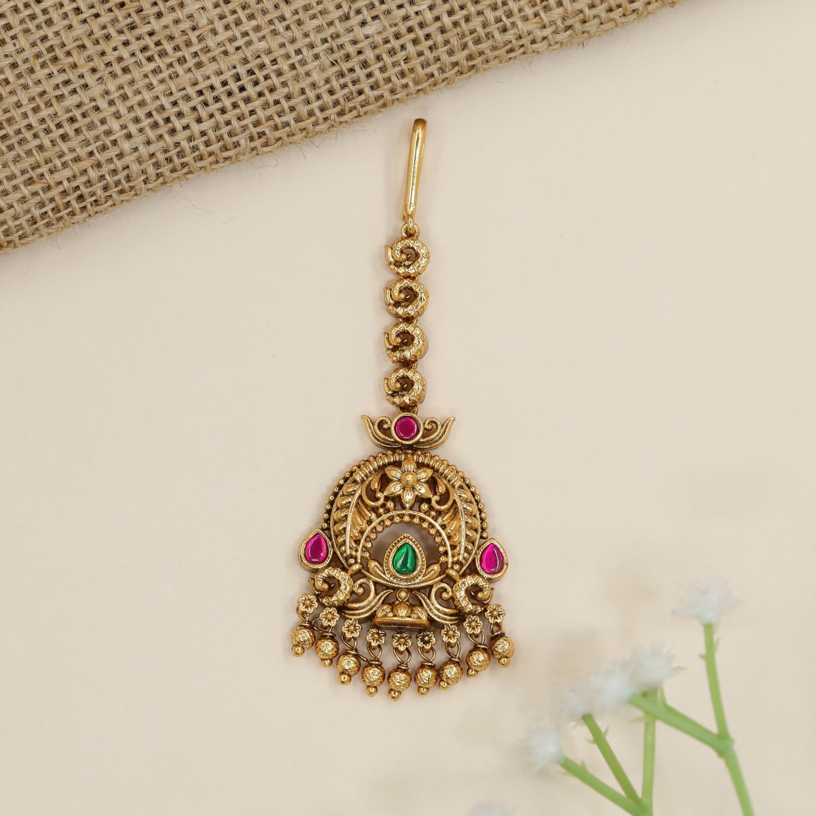 Traditional antique tikka with ornate arch detailing