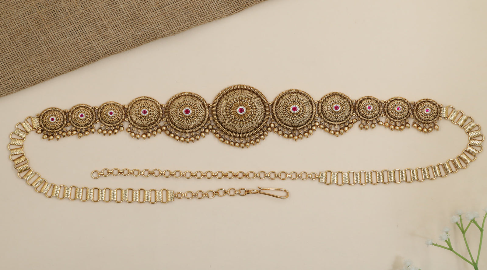 Statement waist belt with graduated medallion craftsmanship