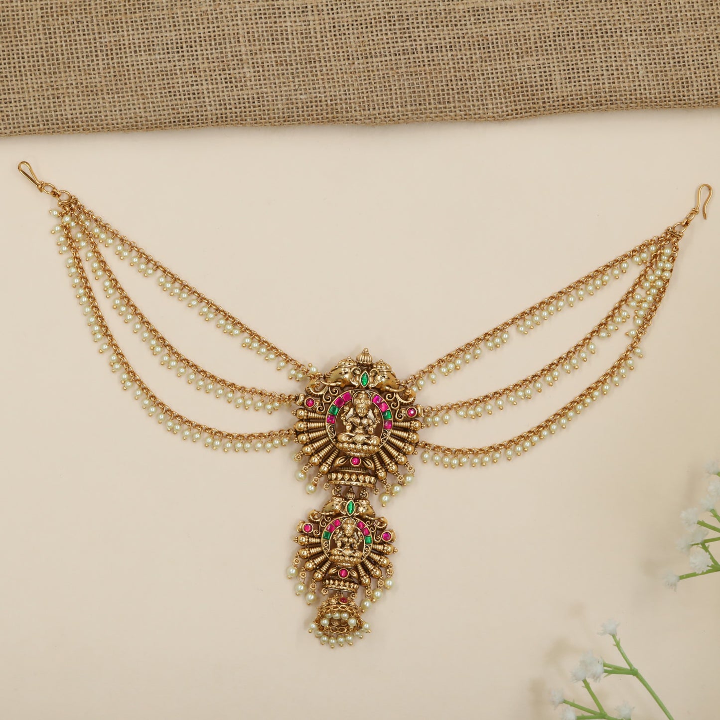Statement jade bille with temple-inspired Lakshmi motif