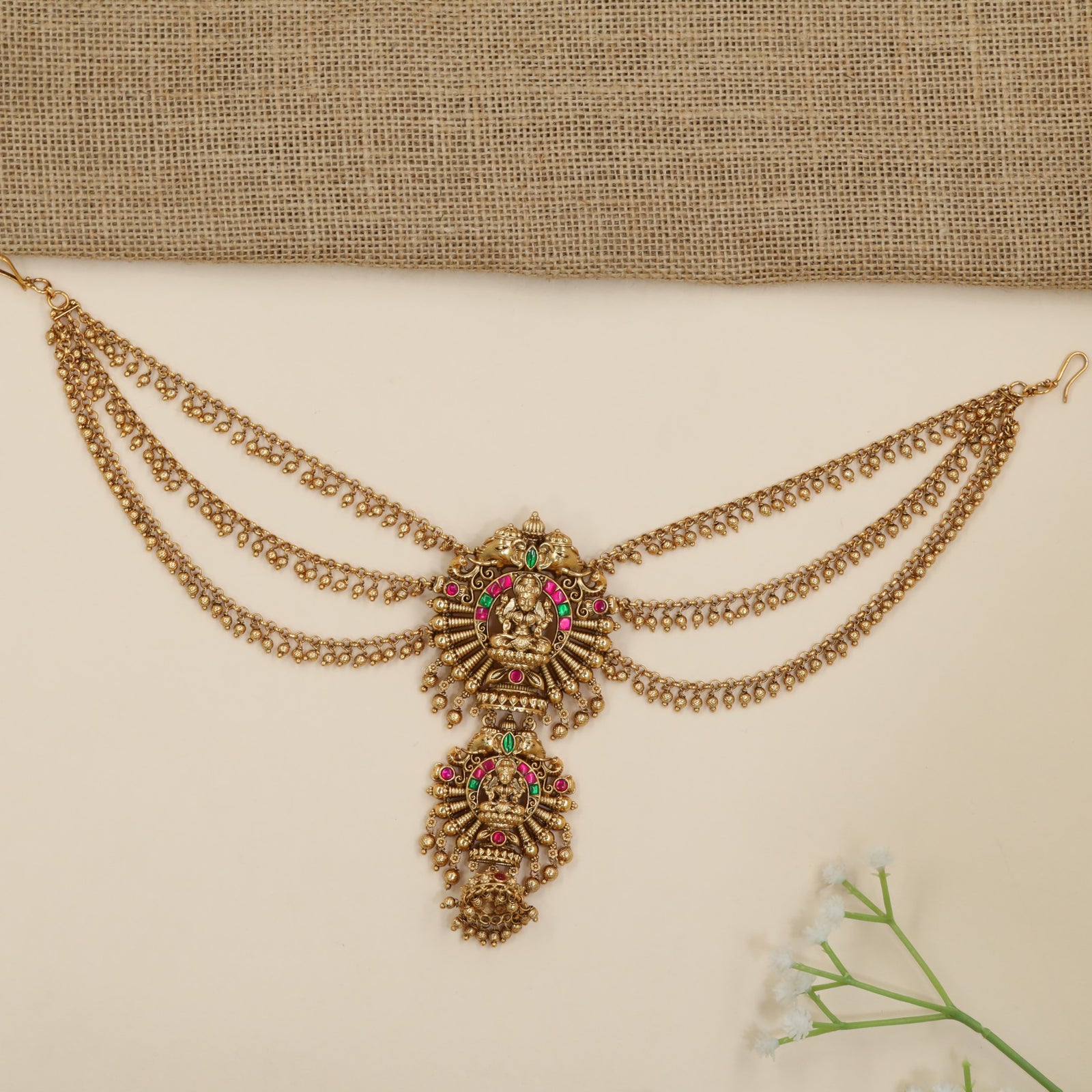 Statement jade bille with temple-inspired Lakshmi motif