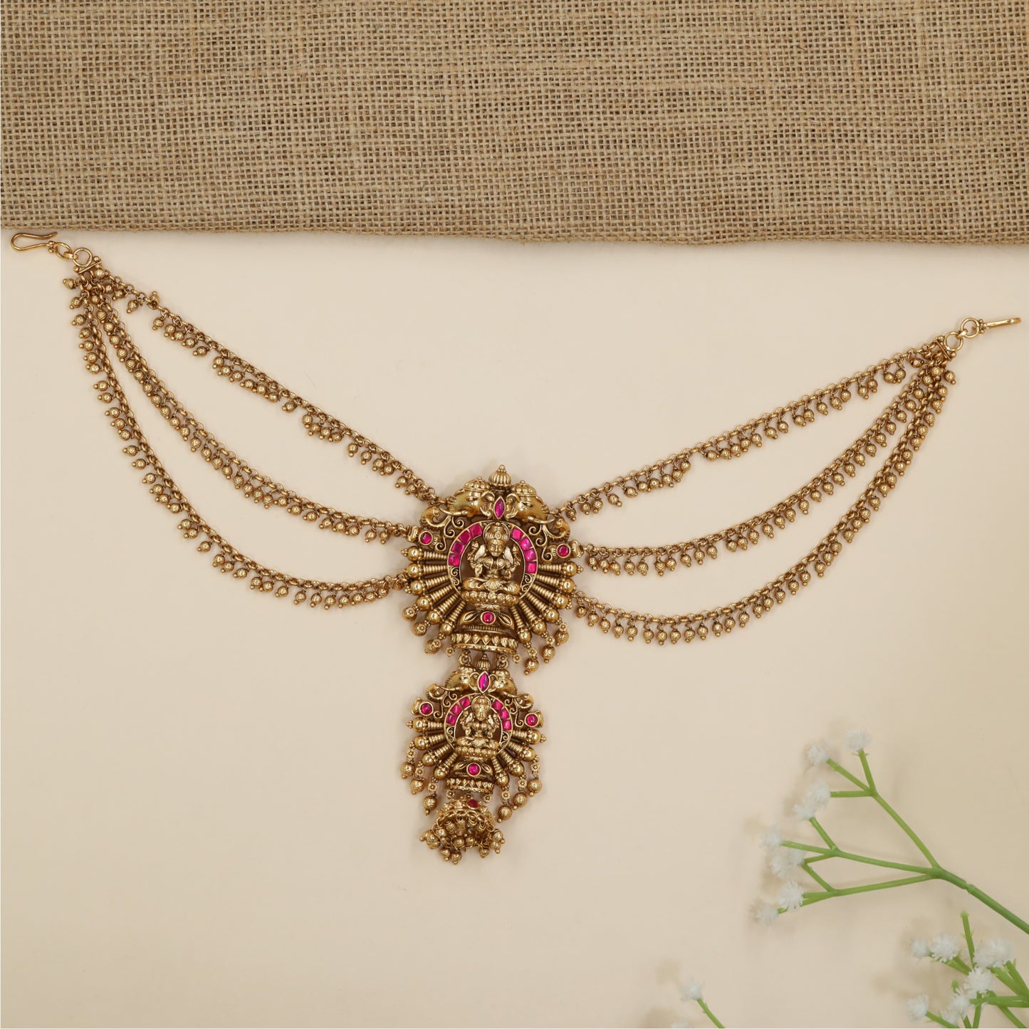 Statement jade bille with temple-inspired Lakshmi motif