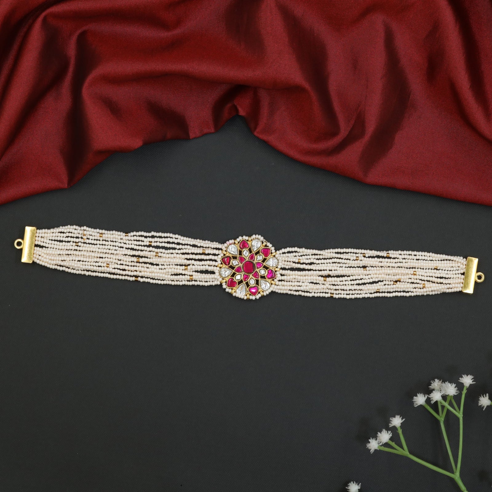 Floral jadau beads choker with multi-strand pearl design