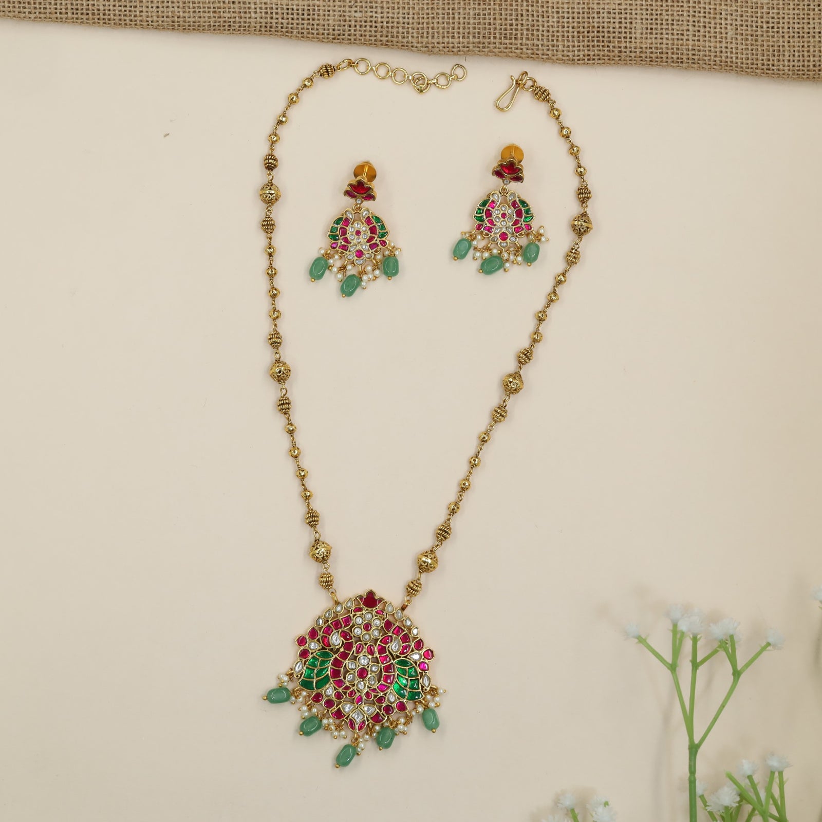Grand Jadau chain with statement peacock medallion and bead tassels