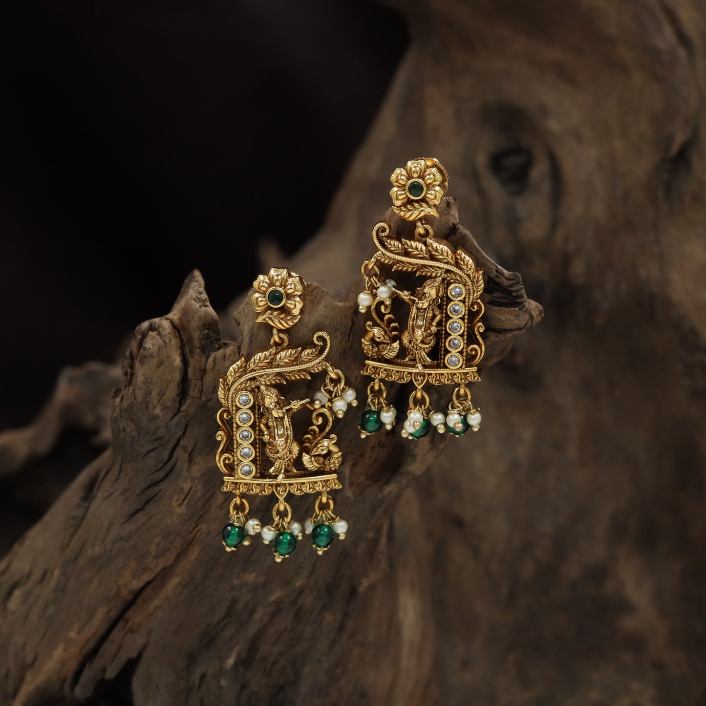 Designer hanging earrings with Lord Krishna and ornate scrollwork