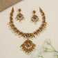 Designer temple necklace with decorative scroll links and ornate centrepiece