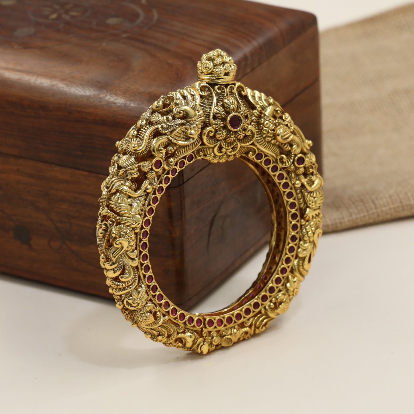 Ornamental antique kada with heritage carvings and raised cobra design
