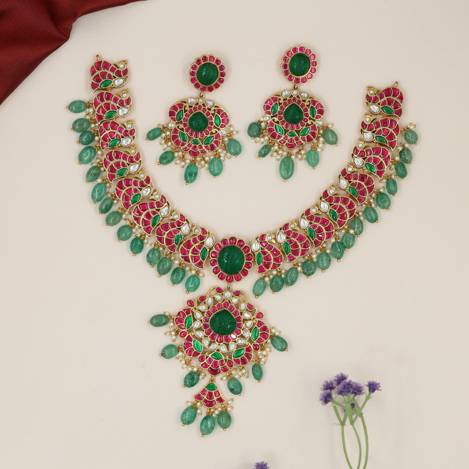 Classic jadau necklace with peacock pattern and floral pendant design