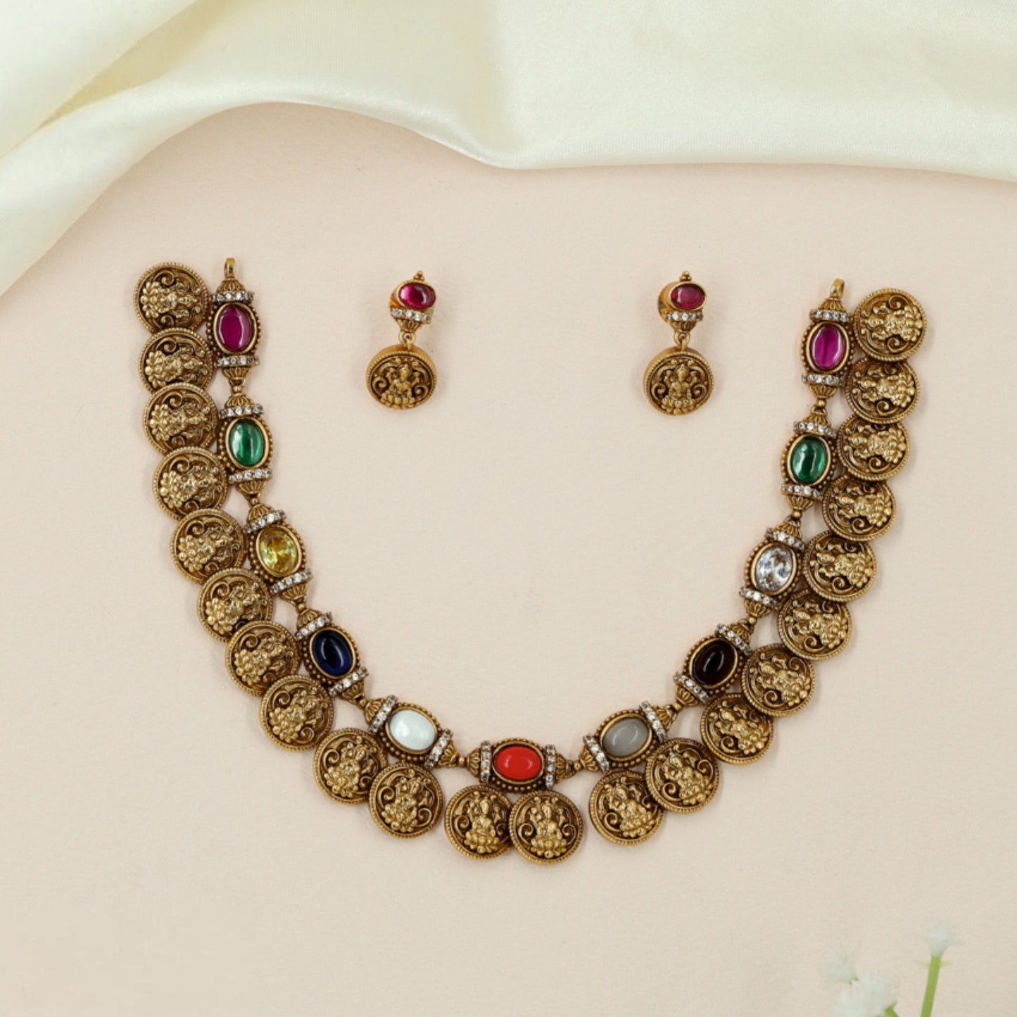 Grand coin necklace with intricately embossed medallions and artisan finish