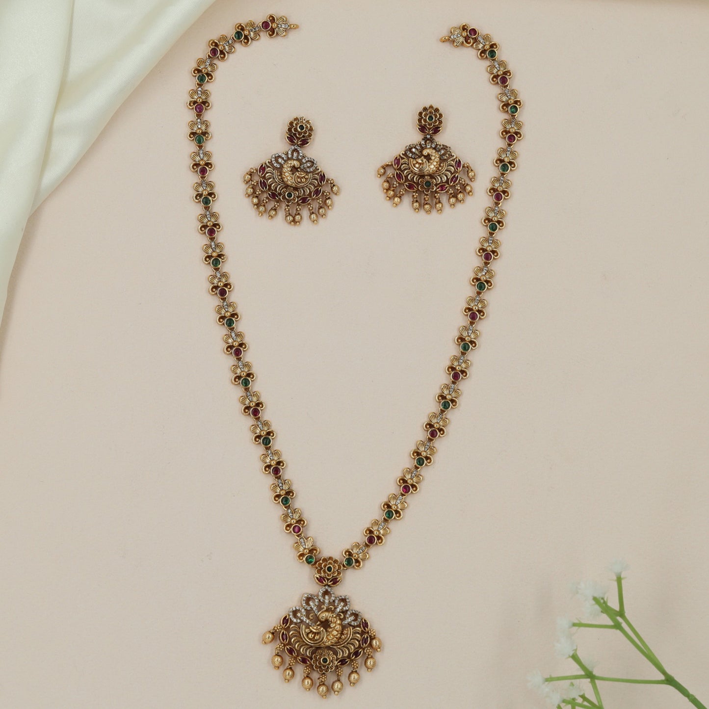 Antique long haara with peacock pendant and floral link chain