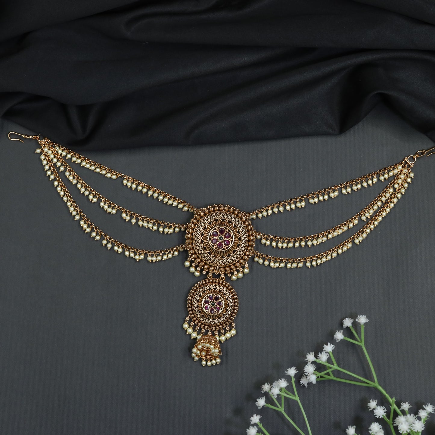 Bridal bille mati with circular medallion and chain drape design