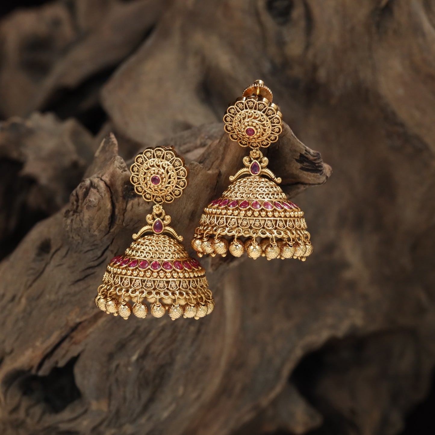 Intricate jhumka with floral medallion top and layered dome design