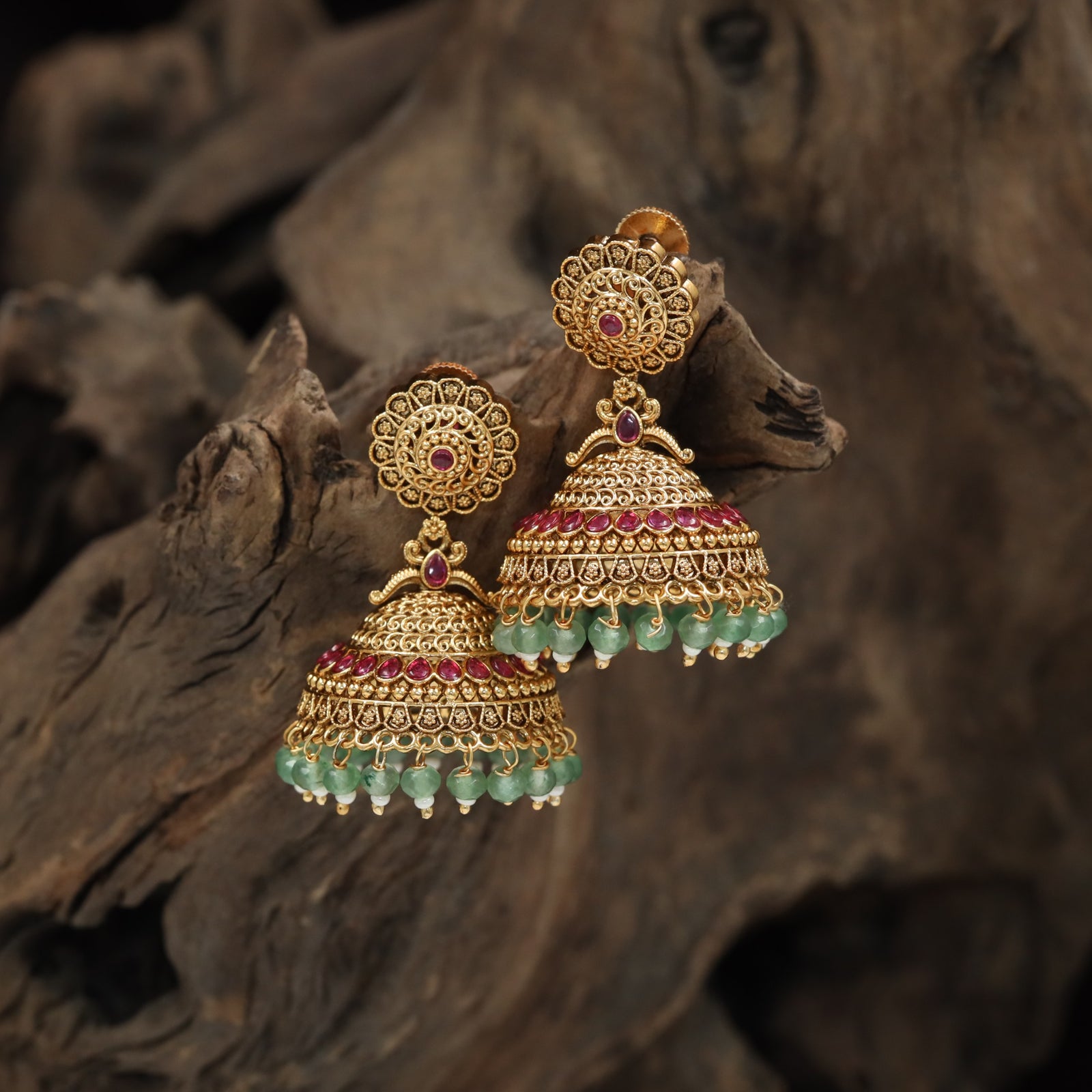 Intricate jhumka with floral medallion top and layered dome design
