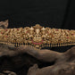 Grand Antique dabu with sculpted temple motifs and bead fringe