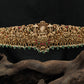 Grand Antique dabu with sculpted temple motifs and bead fringe