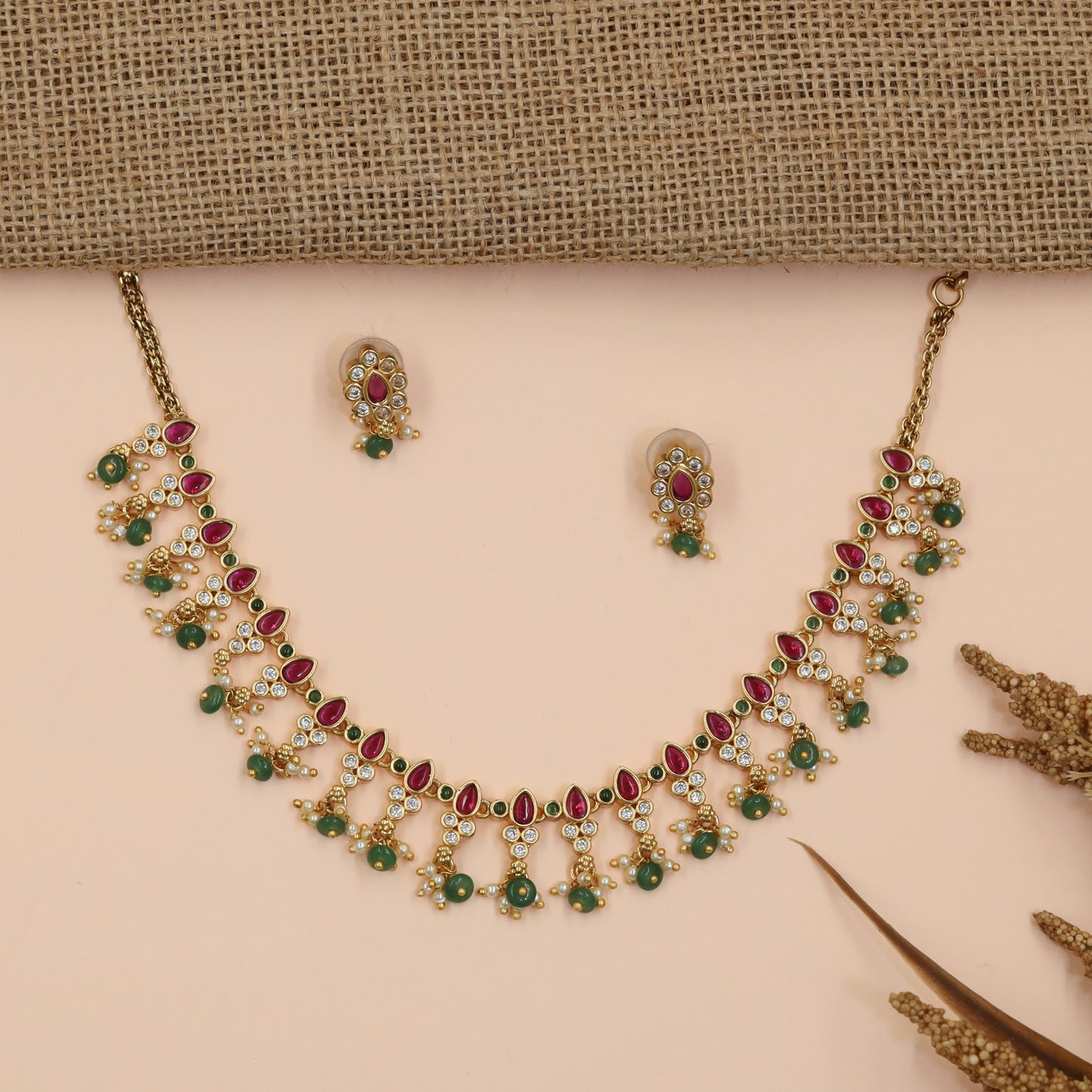 Teardrop Antique Necklace Featuring Floral Stone Arrangement and Dangling Bead Charms