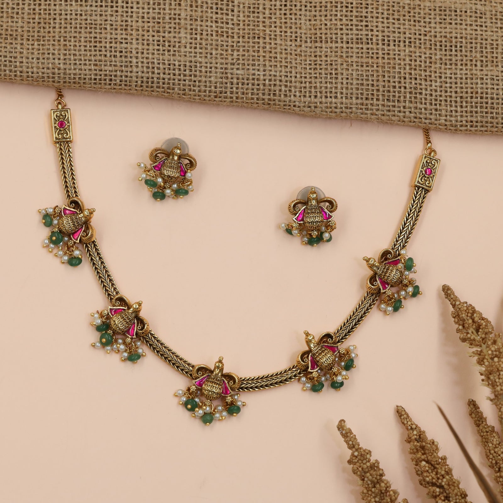 Braided Antique Necklace Featuring Decorative Jhumka Charms and Floral Accents