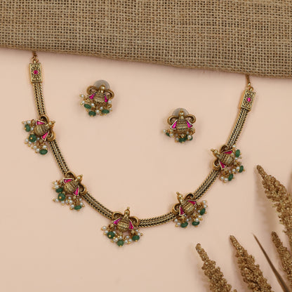Braided Antique Necklace Featuring Decorative Jhumka Charms and Floral Accents