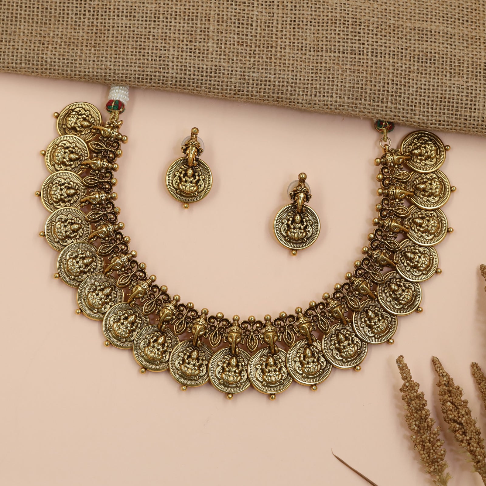 Divine Temple Necklace with Repeating Lakshmi Coins and Ornamental Ganesha Design
