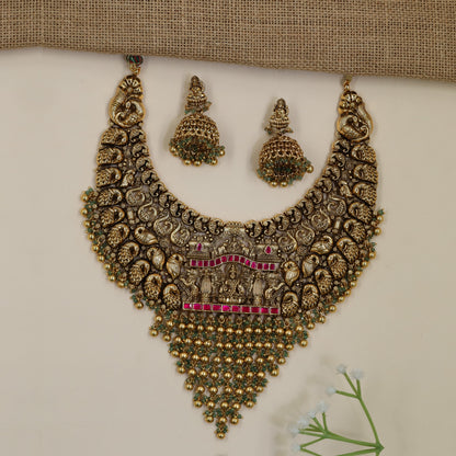 Antique Necklace Featuring Intricate Scrollwork and Central Lakshmi